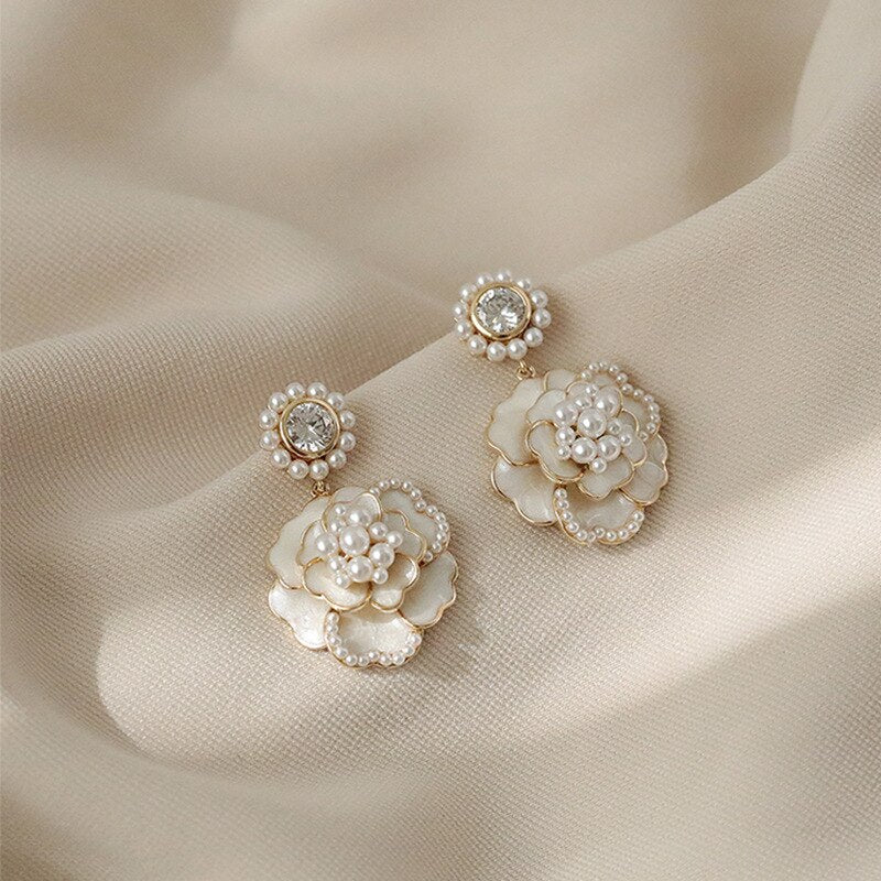 White and gold petal earrings